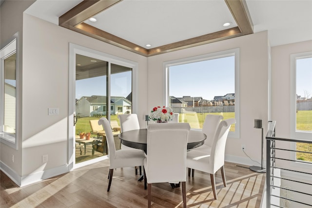 dining space featuring recessed lighting, baseboards, and wood finished floors