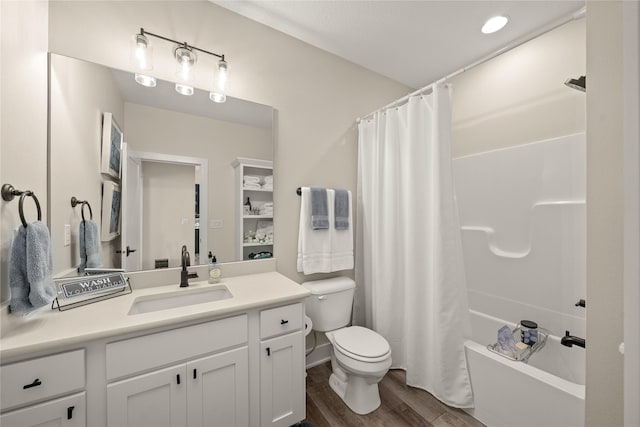 bathroom with toilet, shower / bath combo, wood finished floors, and vanity