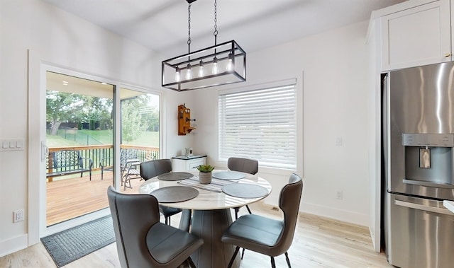 dining area featuring light wood-type flooring