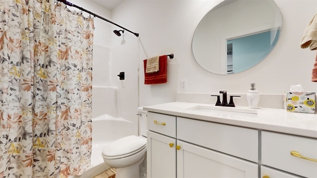 bathroom with vanity, toilet, and walk in shower