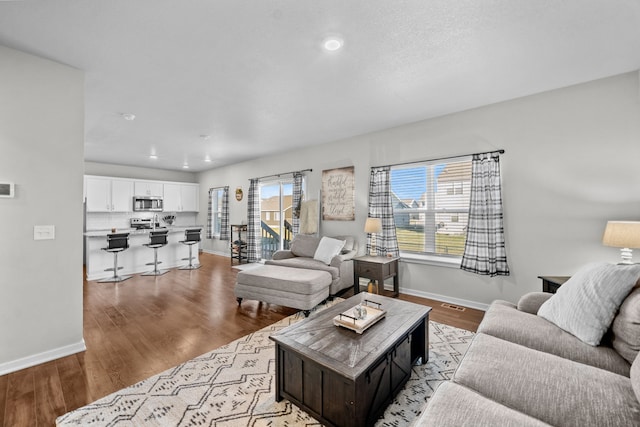 living room with light hardwood / wood-style floors