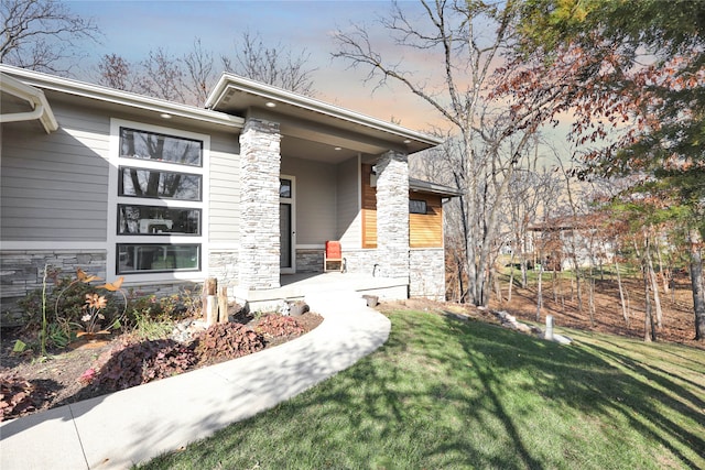 exterior space featuring a yard and covered porch