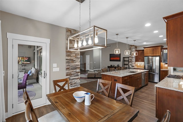 dining area with dark hardwood / wood-style flooring and sink