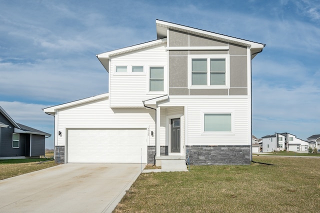 view of front of home with a garage and a front yard