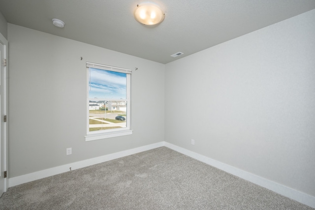 empty room with carpet flooring