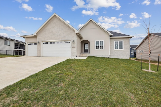 view of front of house featuring a front lawn and a garage