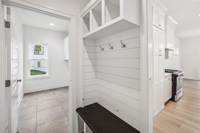 mudroom with light hardwood / wood-style floors