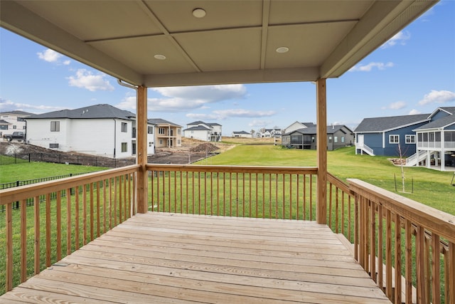 wooden deck with a lawn