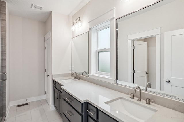 bathroom with vanity and tile patterned floors