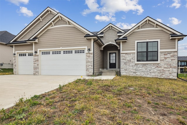 craftsman-style house with a garage and a front lawn