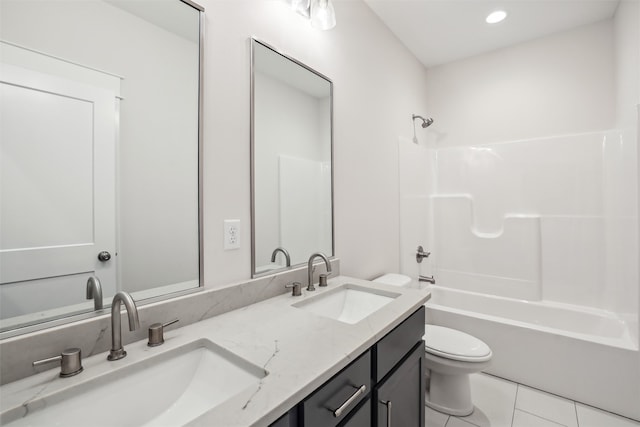 full bathroom with tile patterned flooring, vanity, toilet, and shower / washtub combination