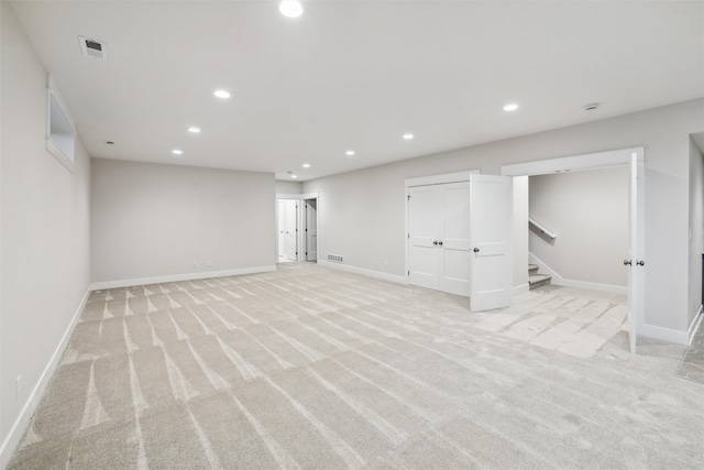 basement with light colored carpet