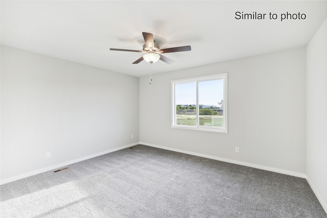 empty room with carpet flooring and ceiling fan