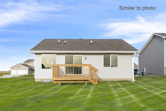 back of property featuring a lawn, cooling unit, and a wooden deck