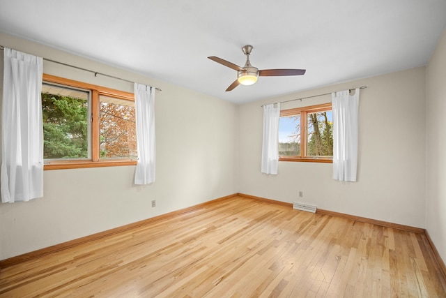 unfurnished room featuring light wood-type flooring and ceiling fan