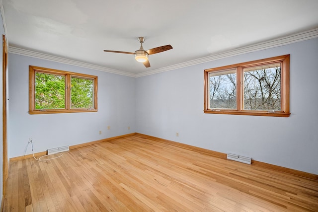 unfurnished room featuring light hardwood / wood-style floors, ceiling fan, and ornamental molding