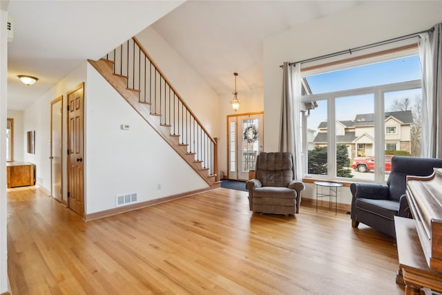 foyer entrance with light hardwood / wood-style floors