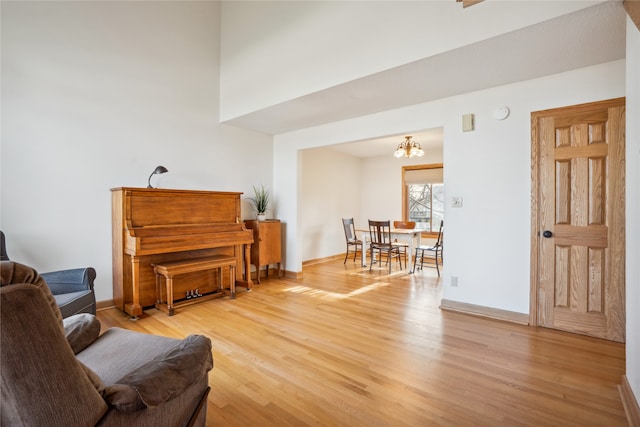 living area with a chandelier and hardwood / wood-style flooring