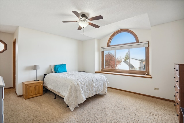 carpeted bedroom with ceiling fan and lofted ceiling