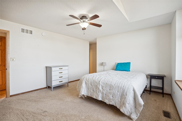 bedroom featuring ceiling fan and light colored carpet