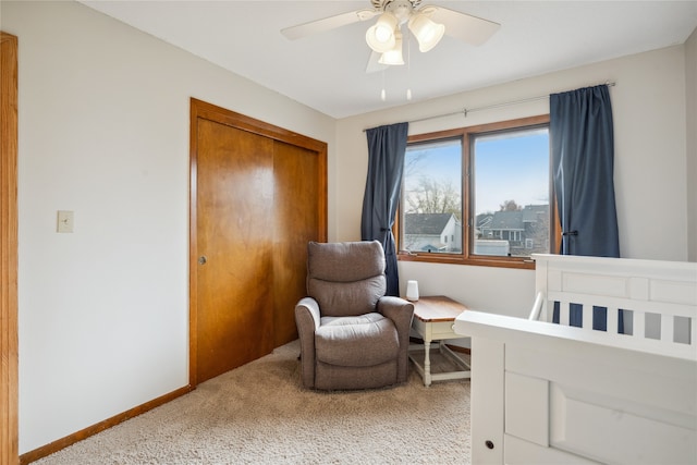 bedroom with ceiling fan, a closet, and carpet flooring