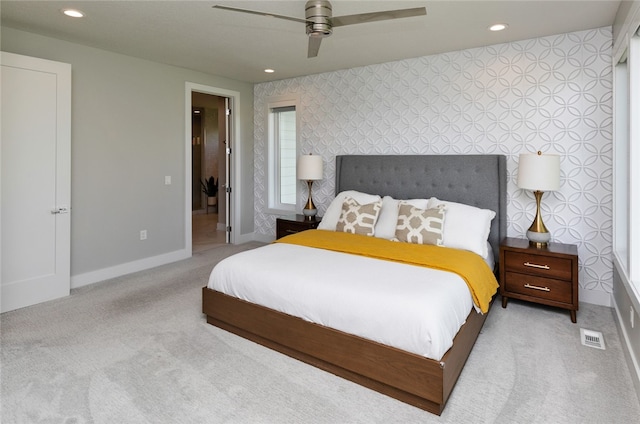 bedroom featuring ceiling fan and light colored carpet