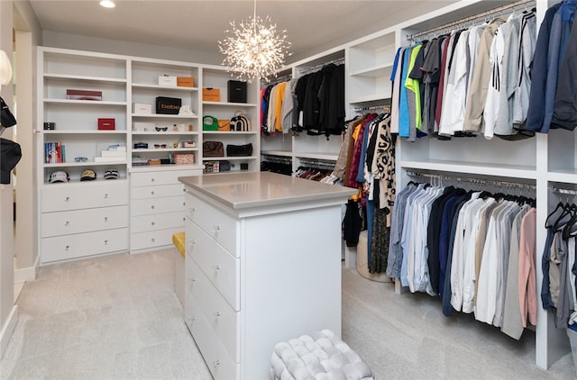 walk in closet with light carpet and a notable chandelier