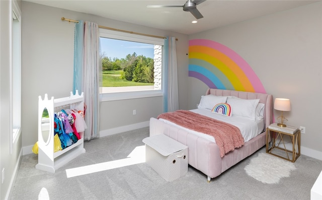 bedroom featuring light colored carpet and ceiling fan