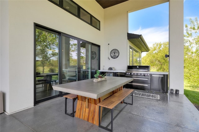 view of patio / terrace featuring a grill and exterior kitchen