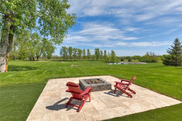 view of patio / terrace featuring an outdoor fire pit