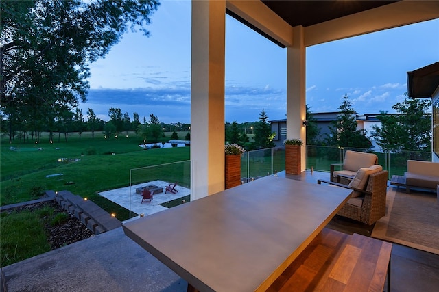 view of patio featuring an outdoor living space with a fire pit