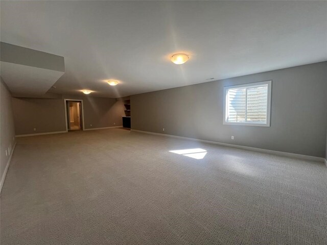 spare room featuring carpet floors