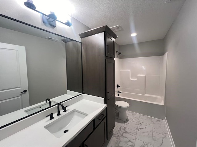 full bathroom with shower / bathing tub combination, vanity, a textured ceiling, and toilet