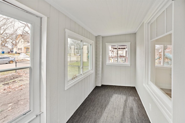 unfurnished sunroom featuring a wealth of natural light