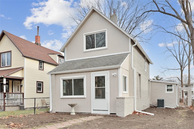 back of property featuring central air condition unit