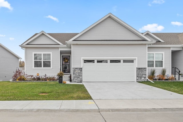 view of front of home featuring a garage and a front lawn