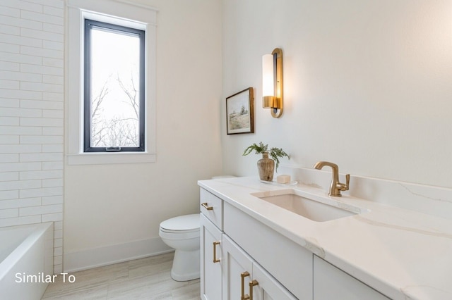 full bathroom with vanity, toilet, and independent shower and bath