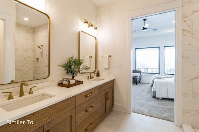 bathroom with ceiling fan, tile patterned flooring, and vanity