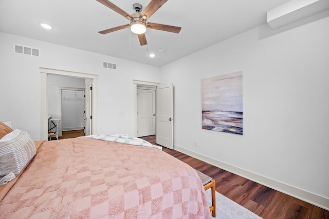 bedroom featuring ceiling fan and dark hardwood / wood-style flooring