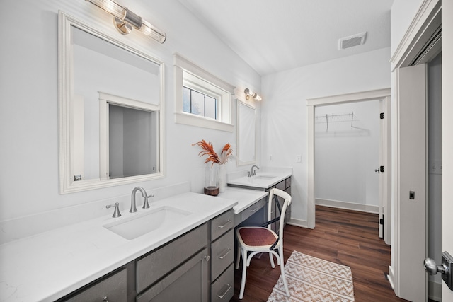 bathroom featuring vanity and hardwood / wood-style flooring