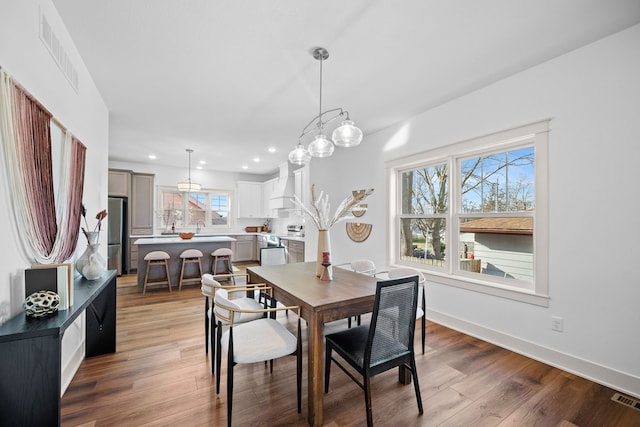 dining space featuring light hardwood / wood-style floors