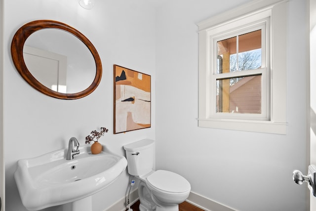 bathroom featuring toilet and sink