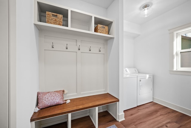 mudroom featuring washing machine and dryer and light hardwood / wood-style floors