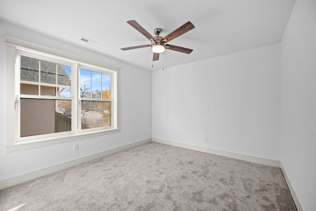 carpeted empty room with ceiling fan