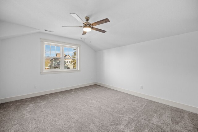 bonus room with ceiling fan, carpet floors, and lofted ceiling