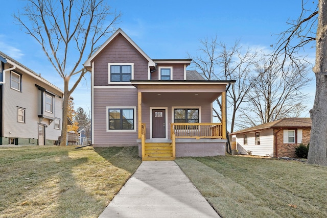 view of front of house featuring covered porch and a front yard