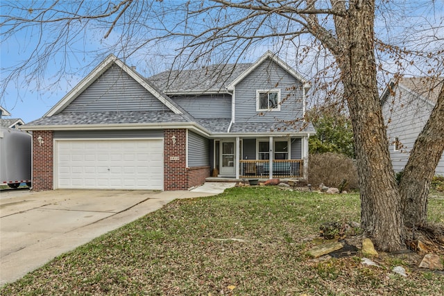 view of front property featuring a garage and a front lawn