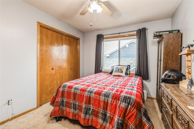 carpeted bedroom featuring a closet and ceiling fan