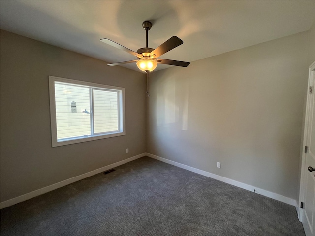 carpeted empty room with ceiling fan