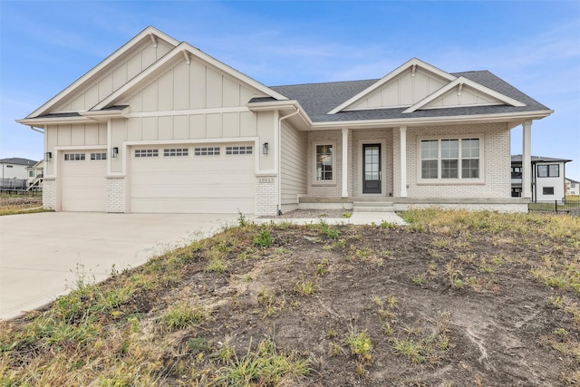 craftsman inspired home with a porch and a garage